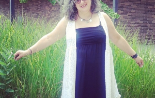 Tehilla Newman arms out enjoying a garden