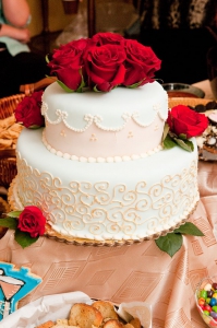 White Wedding Cake with red roses