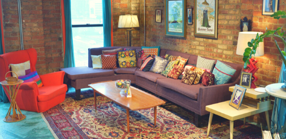 A spacious couch grouping with seating for fewer than 10 people.