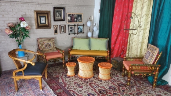 photo of the mango and gold hued ethnic furniture set from Catalyst Ranch Event Rentals