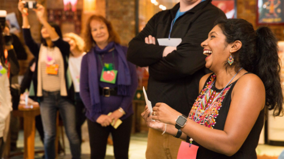 catalyst ranch clients in a meeting laughing, standing in a circle, doing a teambuilding activity