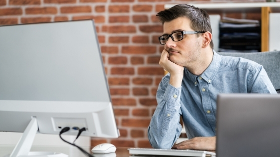 photo of a focus group participant bored at a computer monitor